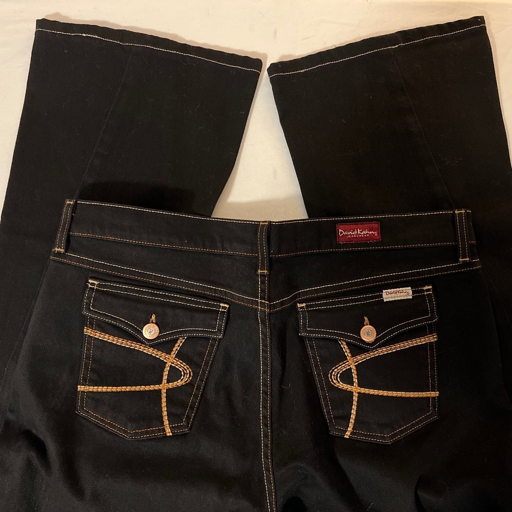 David Kahn Jeanswear Size 31, Inseam is 32". Black with gold stitching